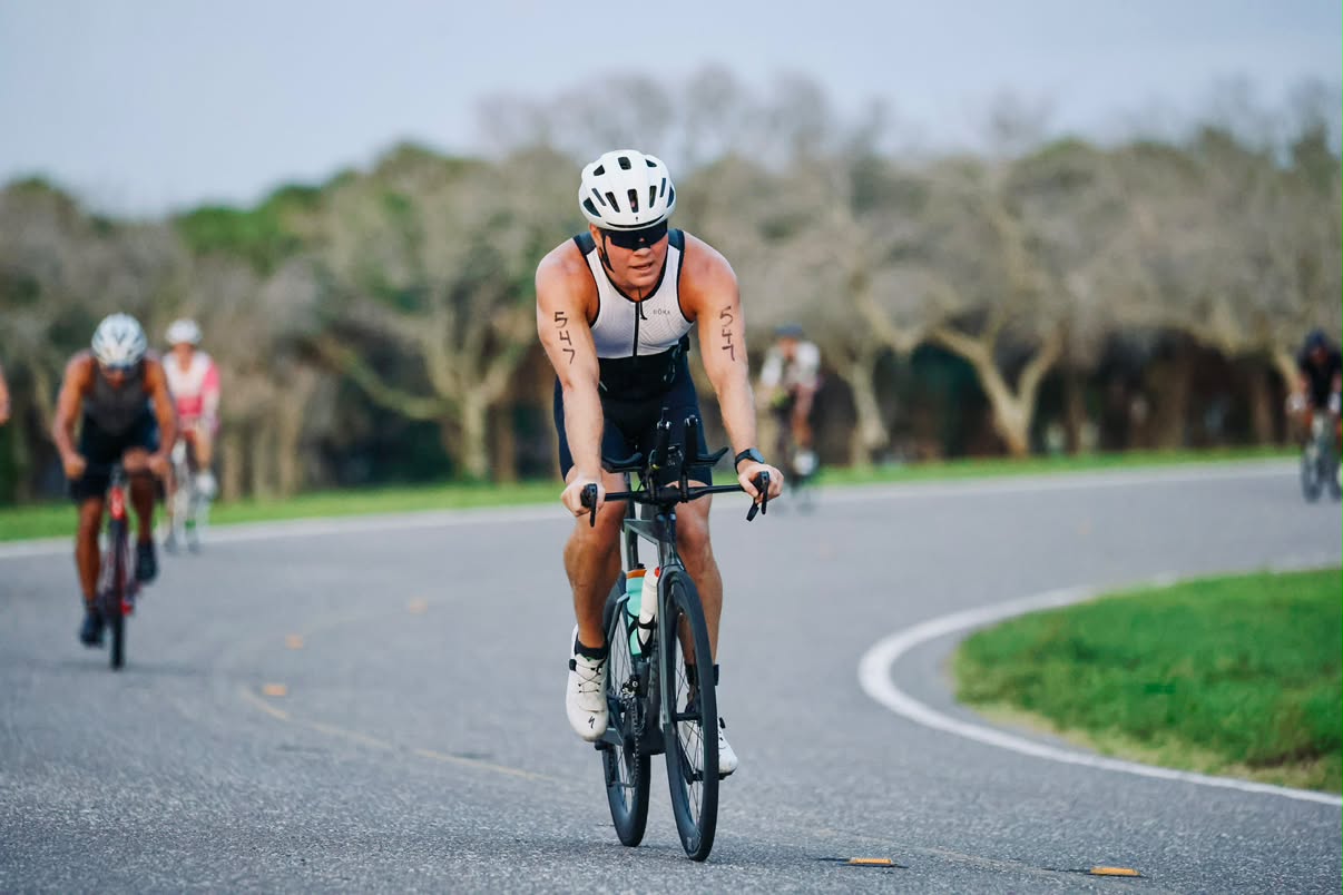 Austin Hammer rides the bike leg of a triathlon.